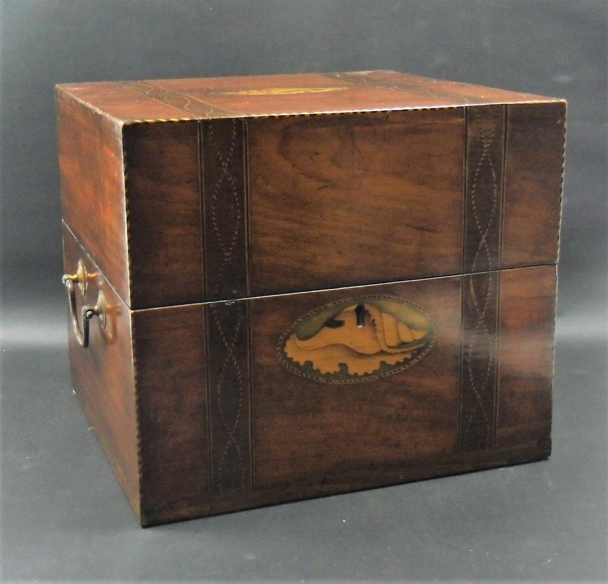 inlaid mahogany box containing nine decanters