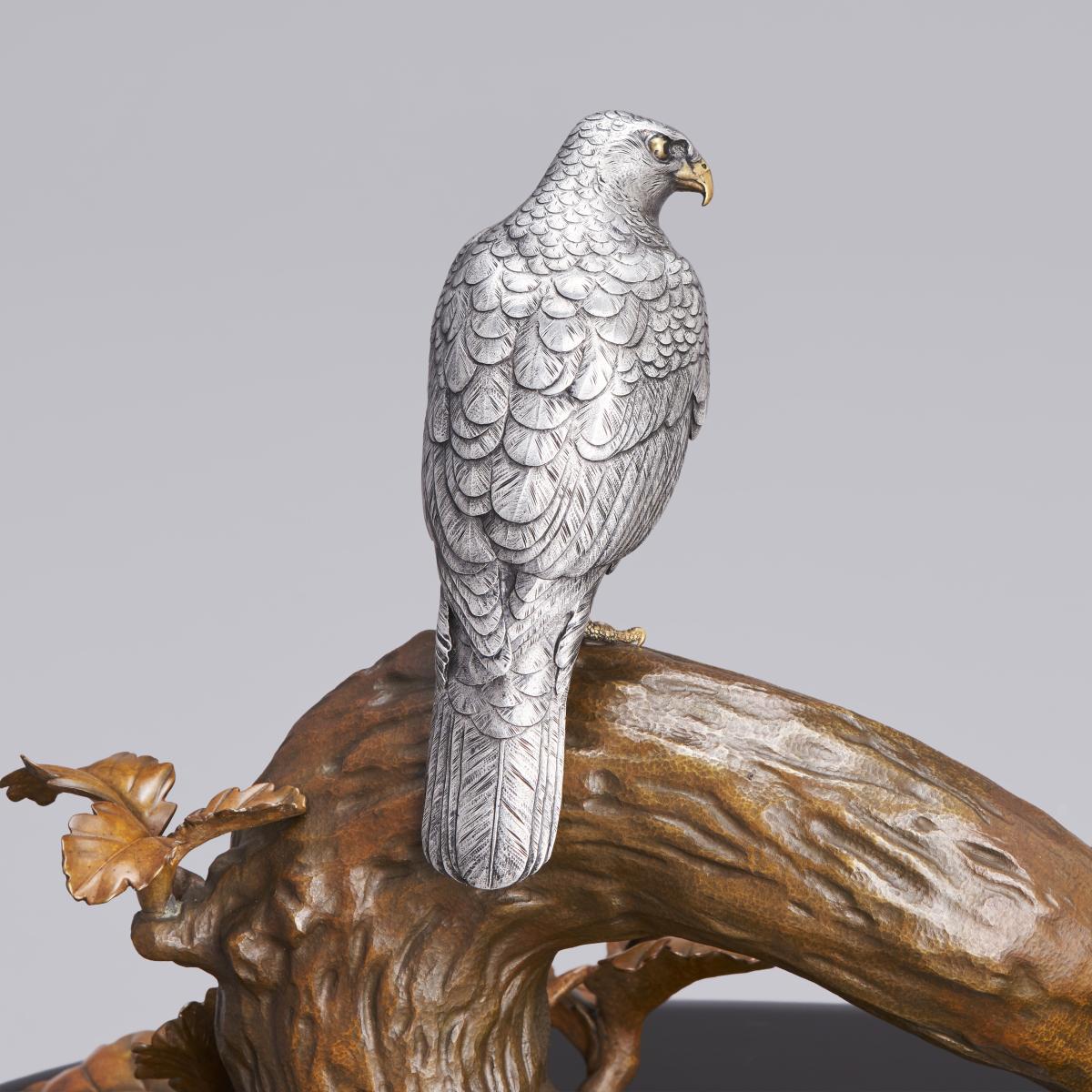 Japanese silver hawk on a bronze tree trunk signed Miyasaka Kazuyoshi, late Meiji Period