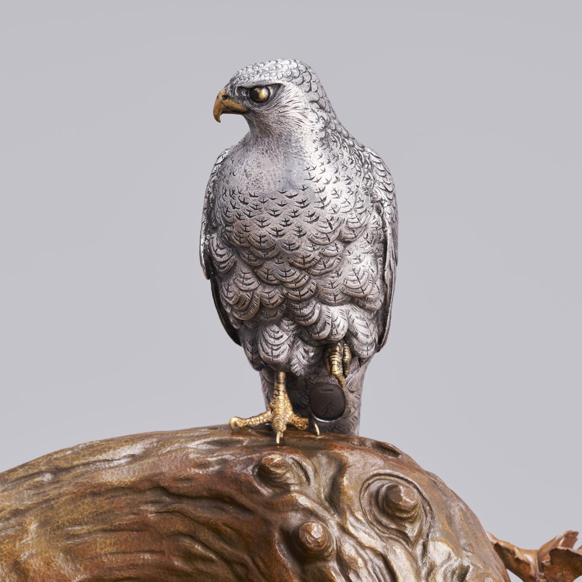Japanese silver hawk on a bronze tree trunk signed Miyasaka Kazuyoshi, late Meiji Period