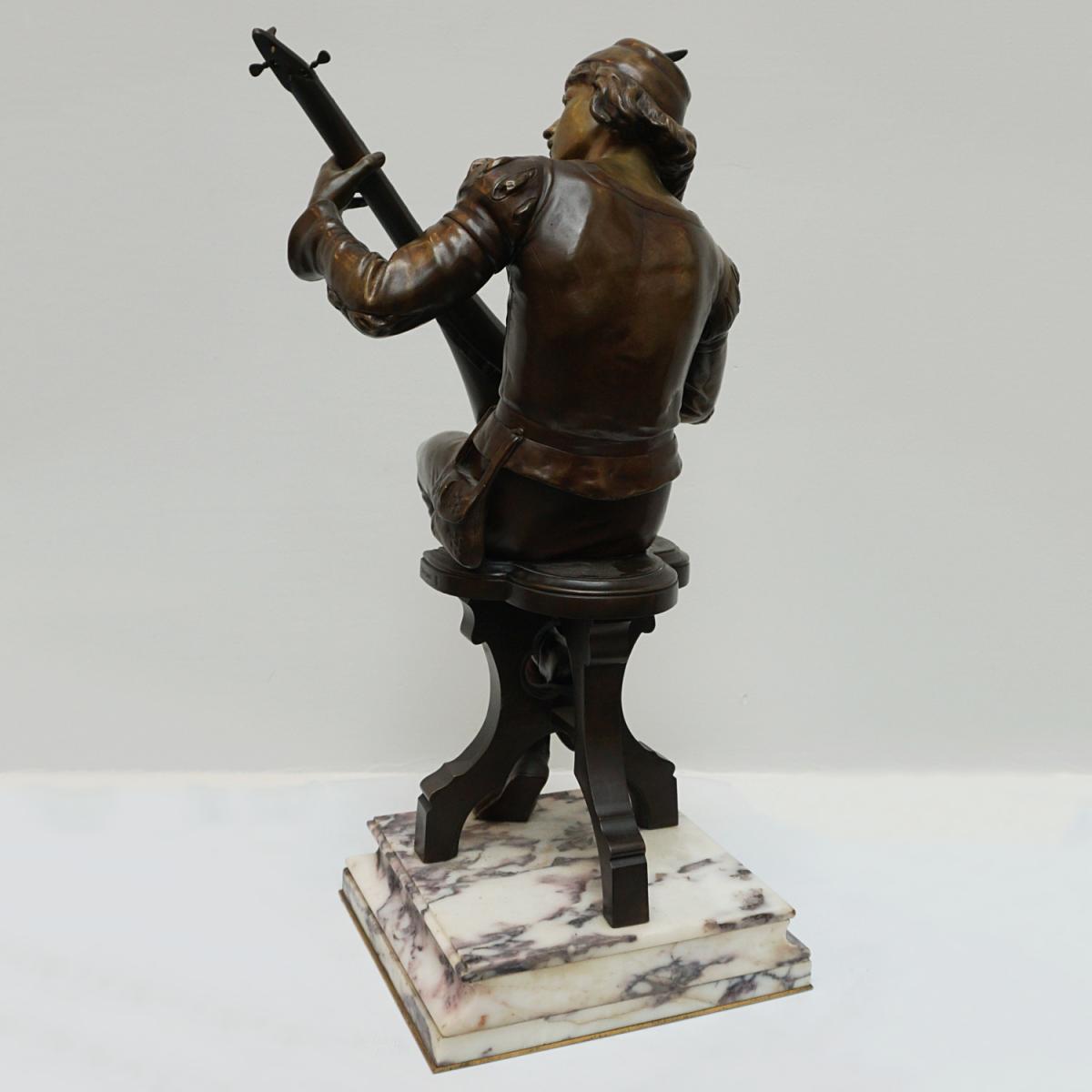 'Seated Minstrel' A late 19th century bronze sculpture by Emile Boisseau