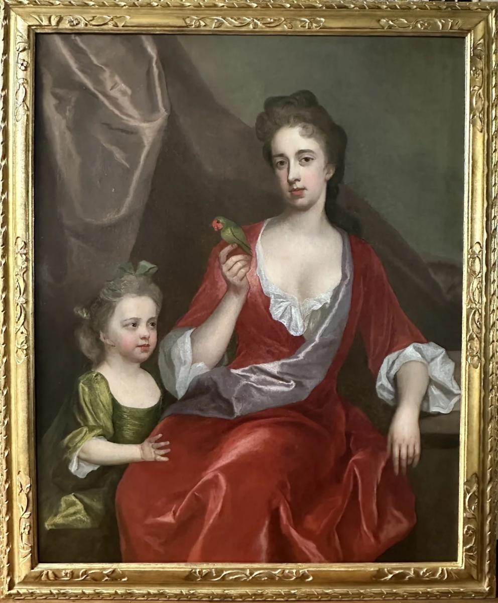 18th century portrait of a lady and her daughter with an exotic bird by Michael Dahl