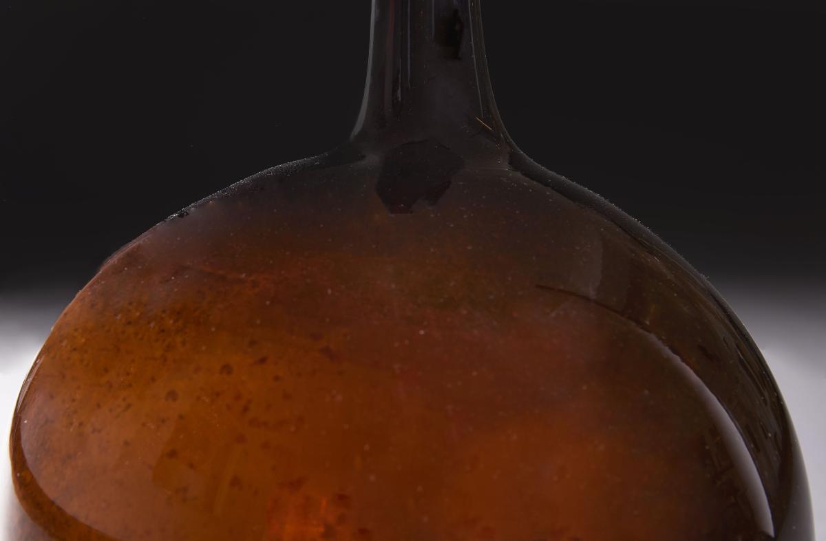 A single amber Glass Vessel as a lamp