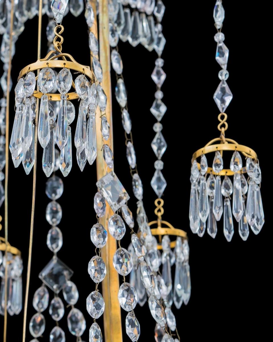 A German Neoclassical Silver and Gilt Bronze Twelve Light Crystal Chandelier Attributed To Werner & Mieth