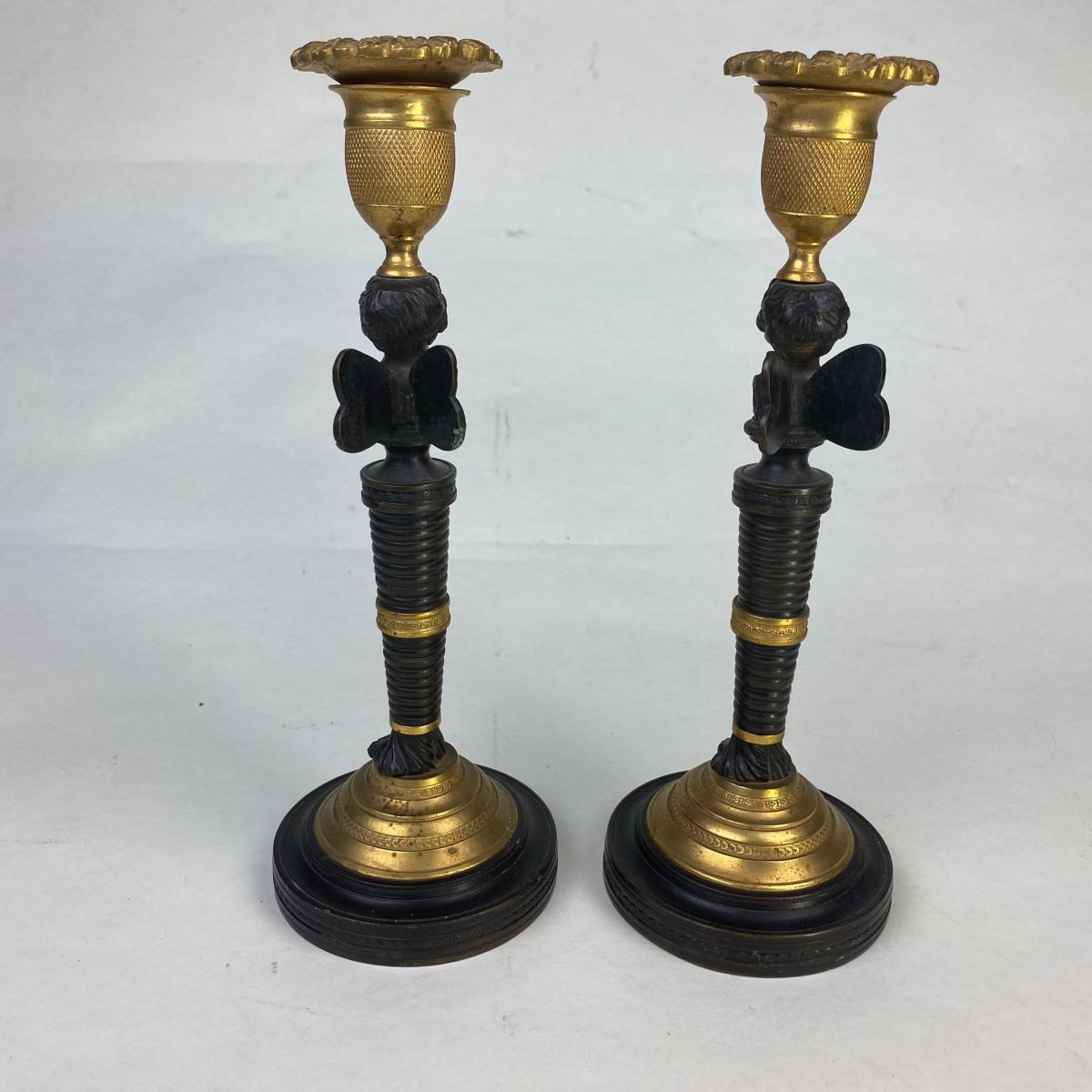Pair of Bronze and Ormolu Putti Candlesticks