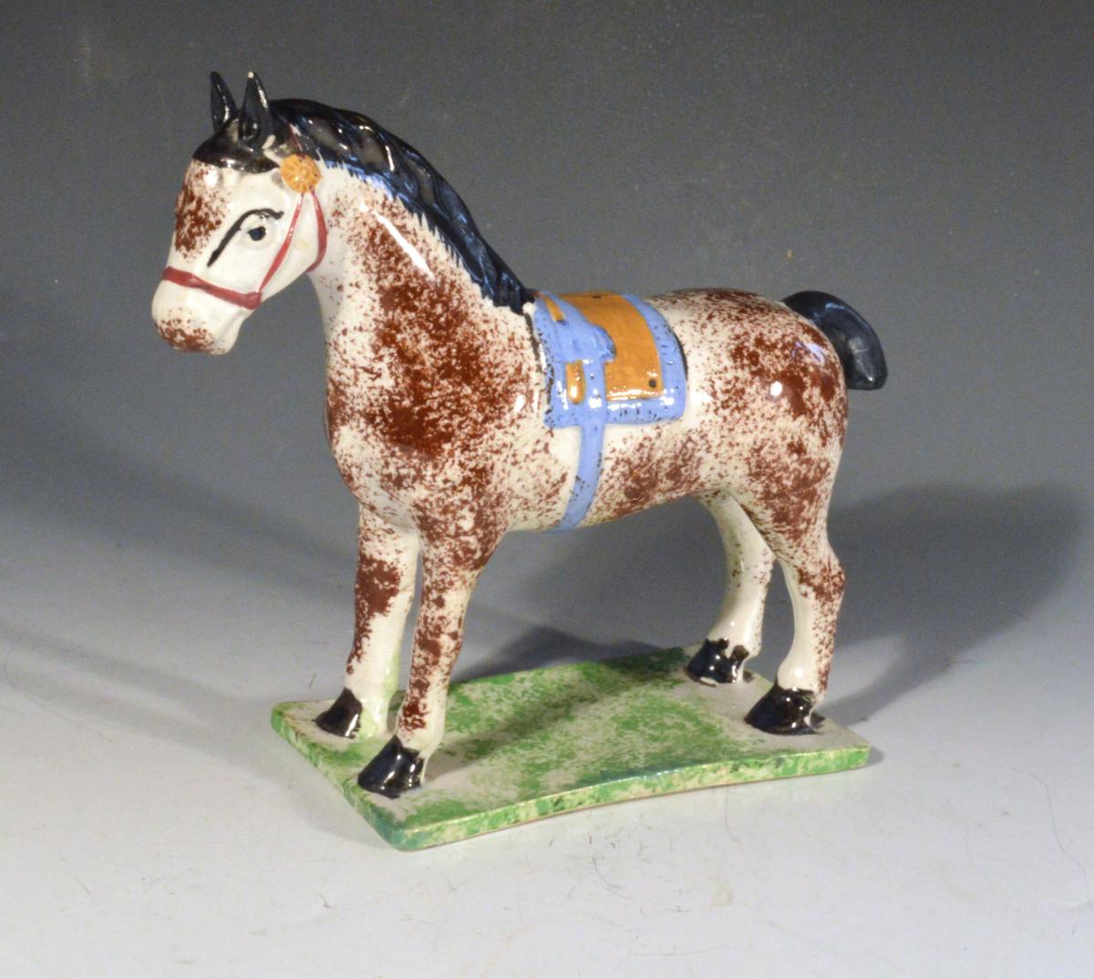 Newcastle Prattware Pottery Model of a Horse, Attributed to St. Anthony Pottery, Newcastle upon Tyne. Circa 1800-20.
