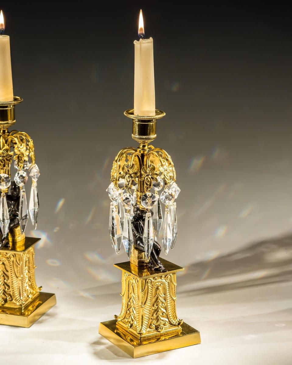 An Unusual Pair of Gilt & Bronze Military Figure Candlesticks