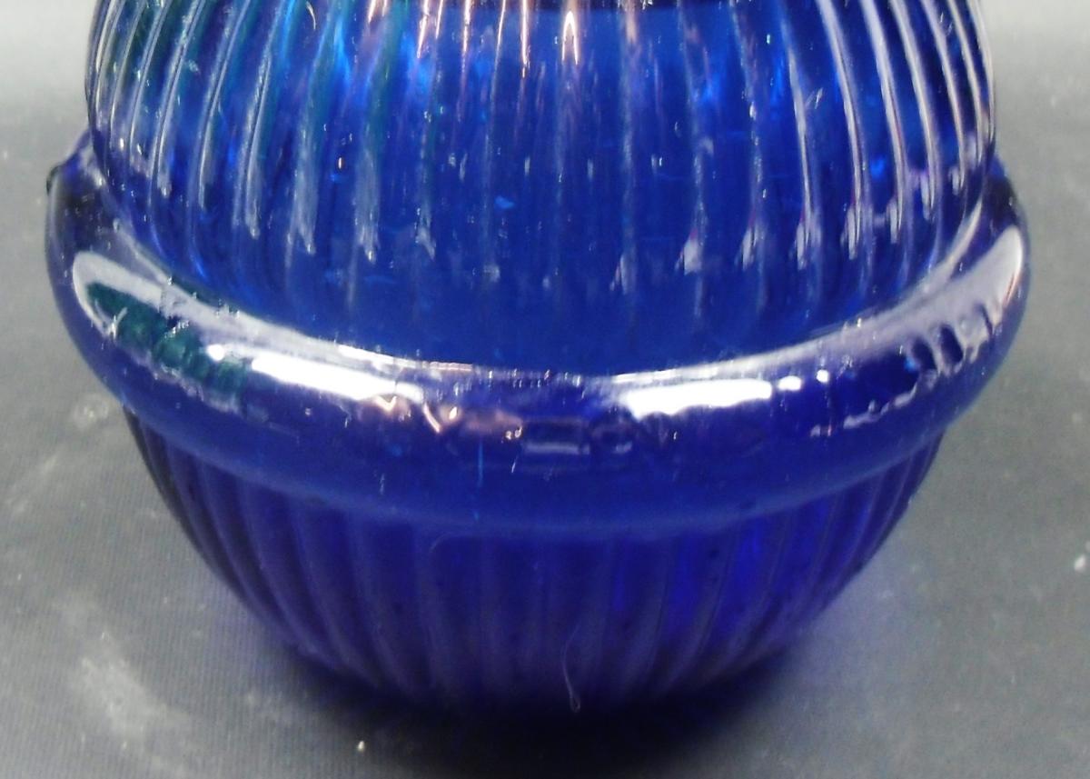 A blue glass Hardens Star fire grenade, sealed and full, English circa 1890