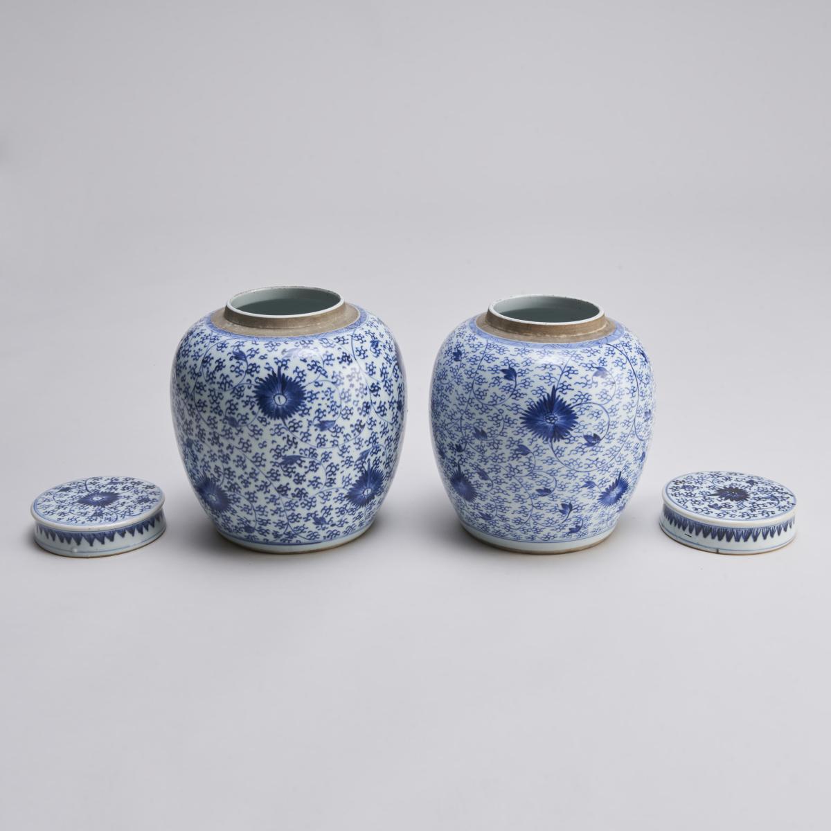A pair of attractive, 18th Century Chinese porcelain blue and white jars and covers