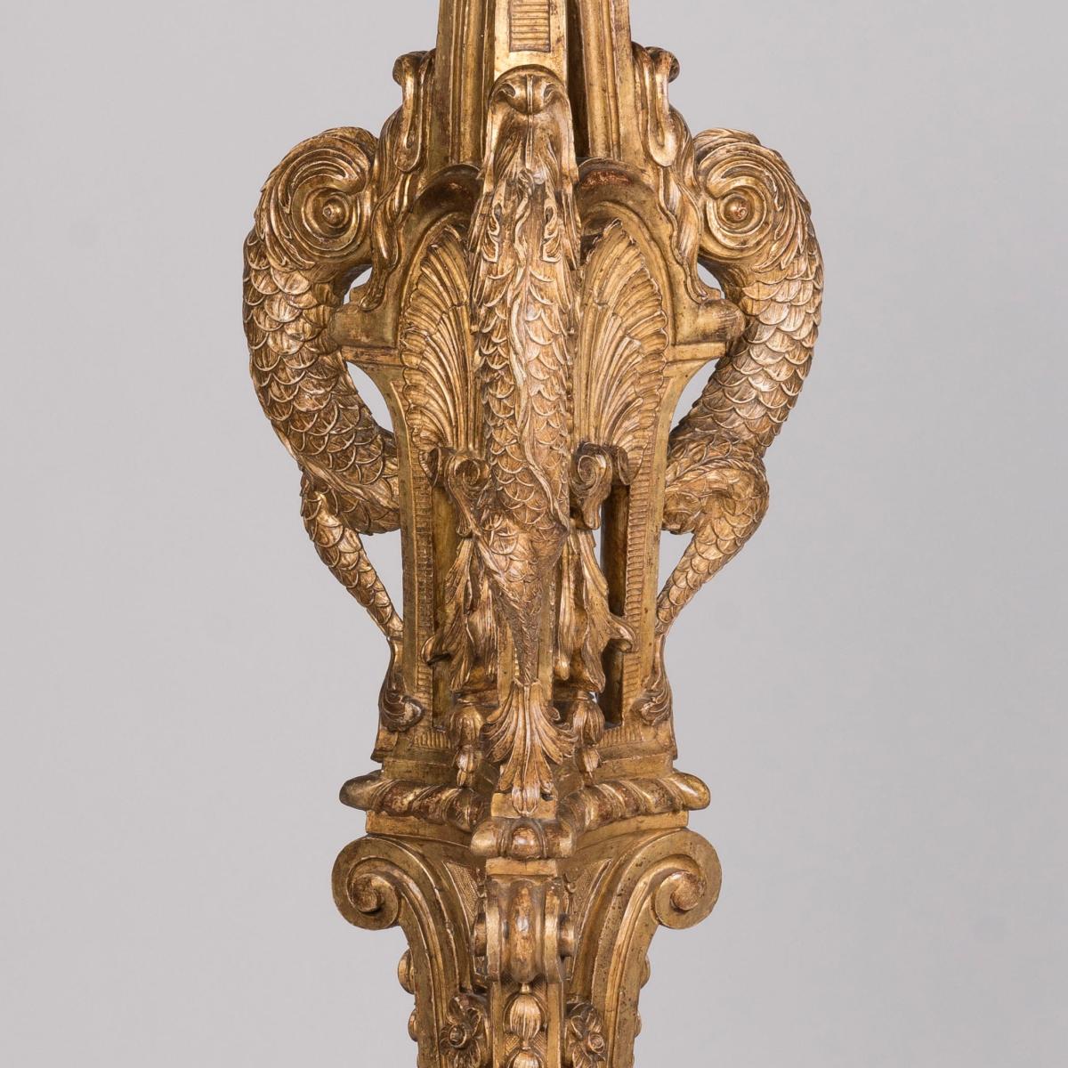 A Pair of Carved Giltwood 'Torchères Aux Dauphins'