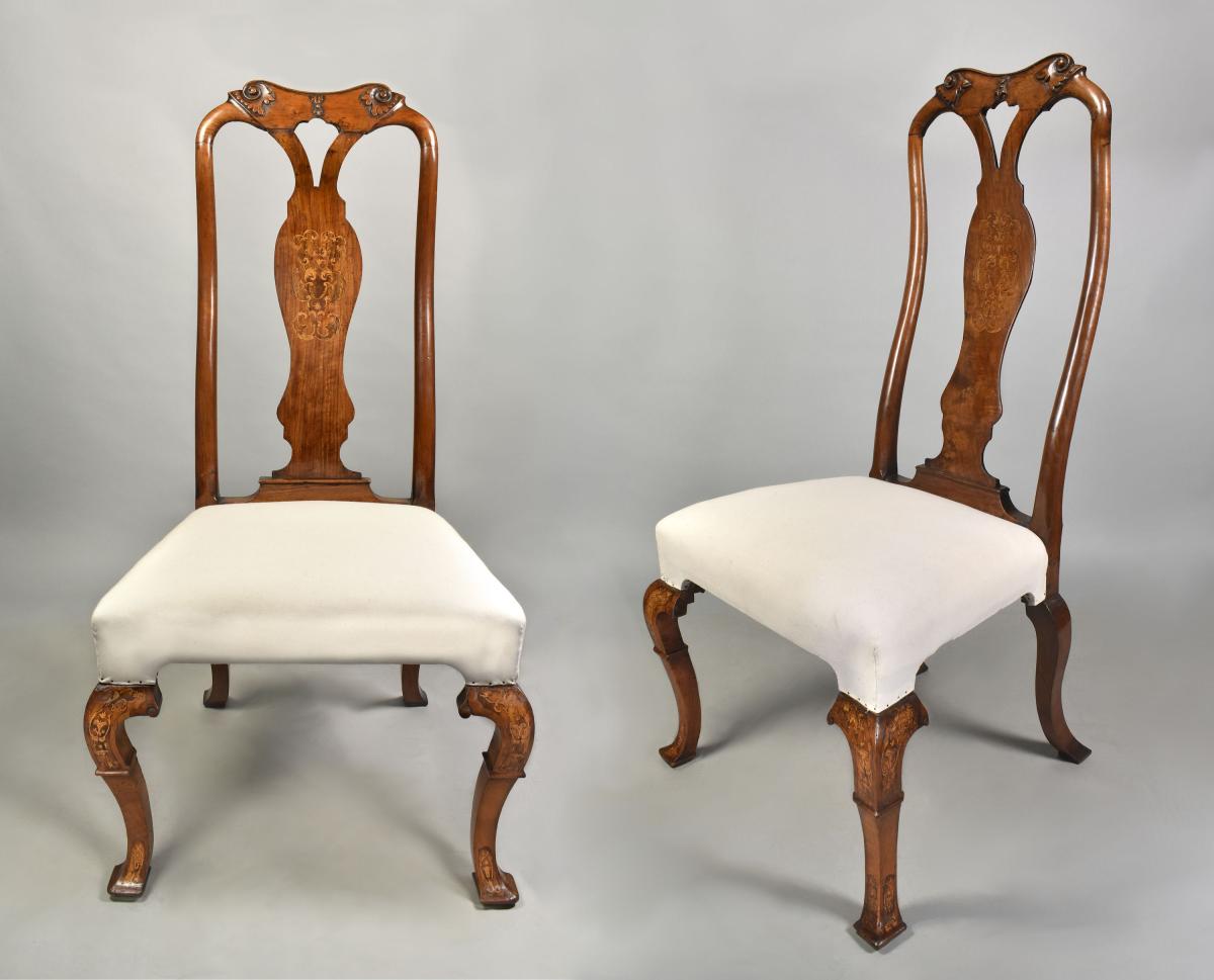 Pair of early eighteenth century walnut chairs with marquetry panels, c.1720