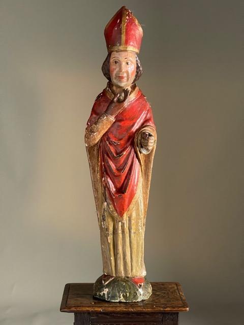 wood carving of a cardinal circa 1530