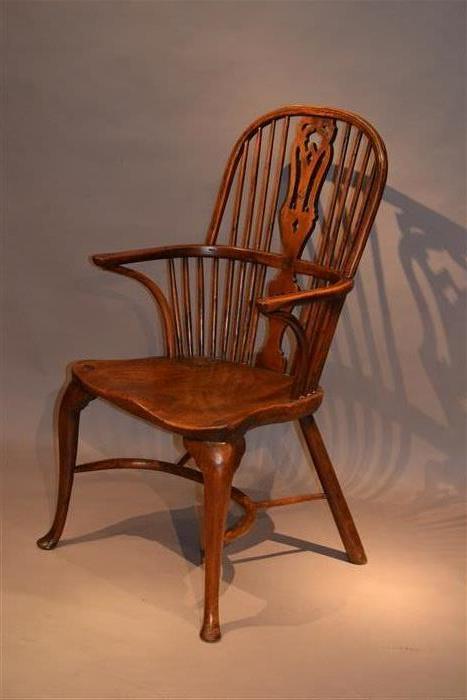 An 18th century yew wood double bow armchair