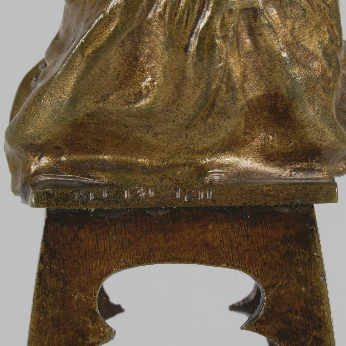 Early 20th Century Bronze Sculpture entitled "Girl Putting on her Shoe" by Juan Clara