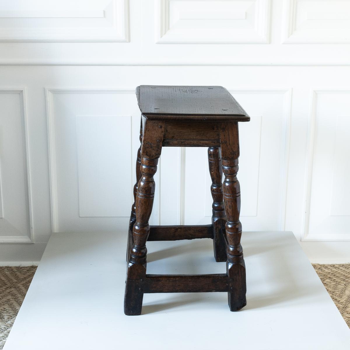 A Charles I oak joint stool, circa 1640