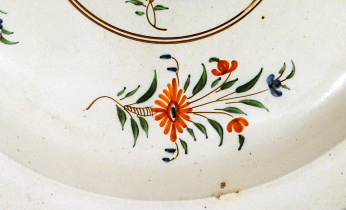 English Creamware Dish with Polychrome Botanical Decoration
