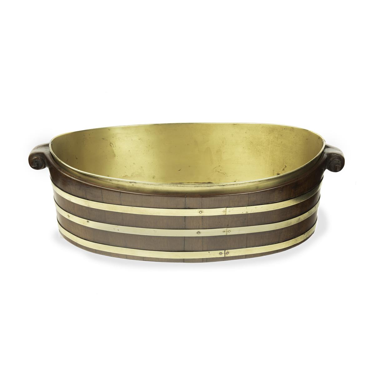A late Georgian brass bound mahogany oyster bucket