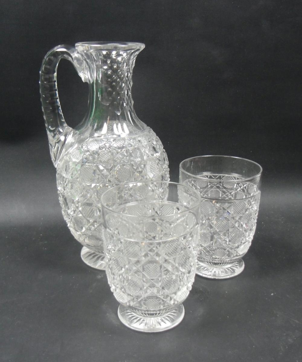 Crystal glass jug and two matching glasses, English circa 1880