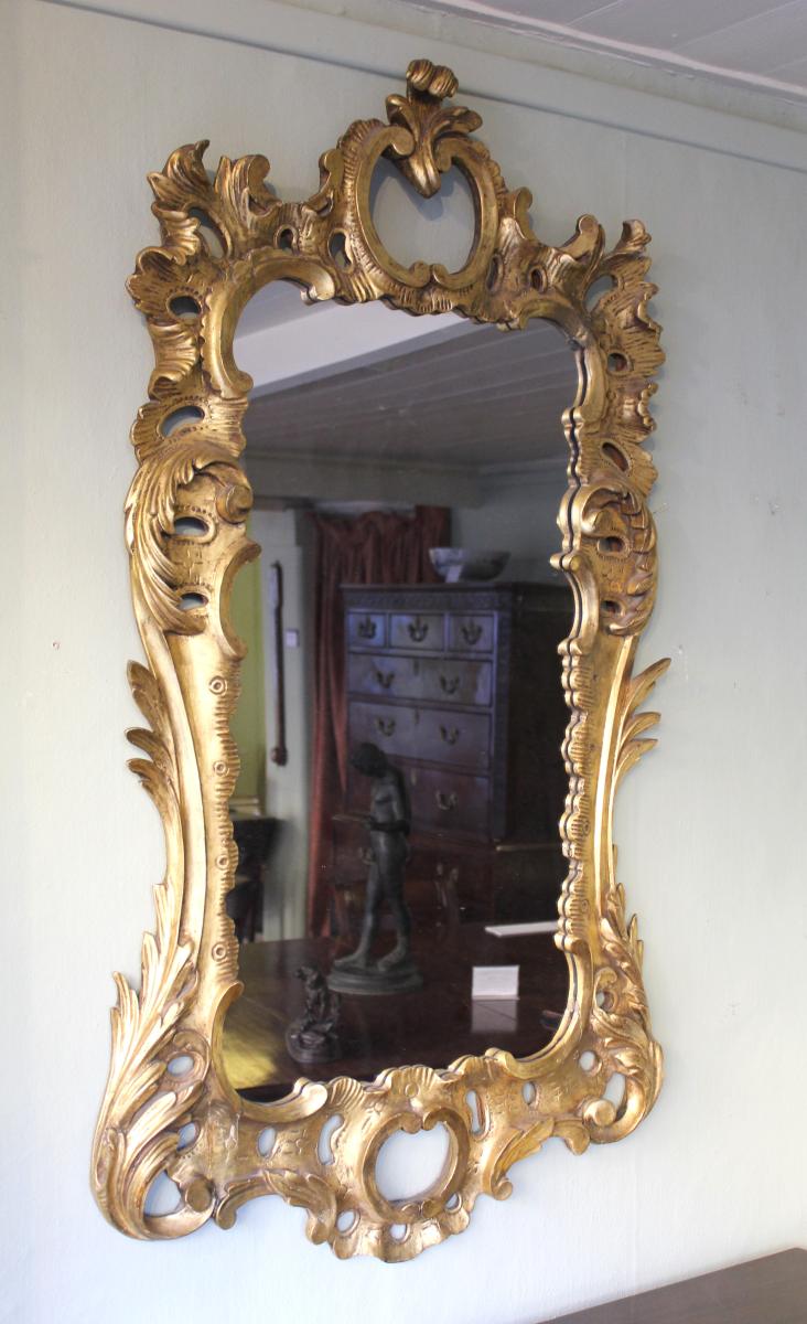 carved and gilt wood mirror in the manner of Matthias Lock (circa 1710 – 1765)