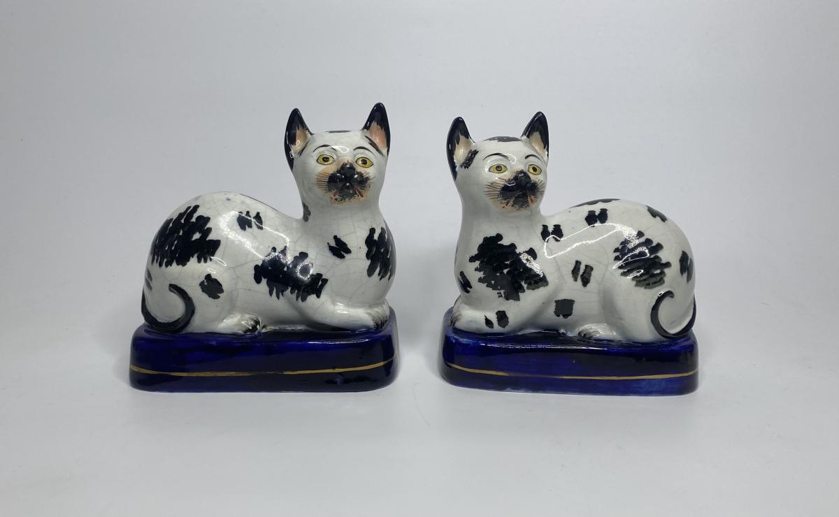 Staffordshire pottery recumbent cats