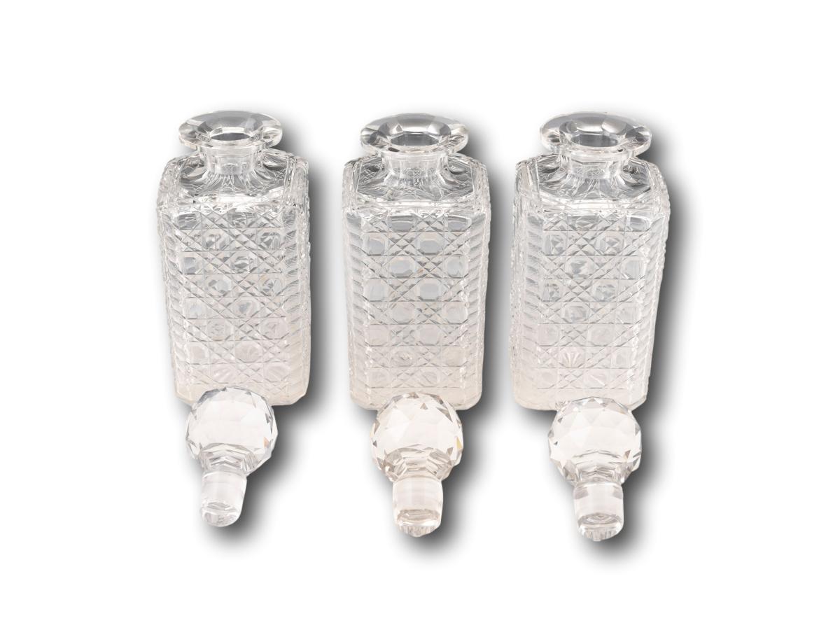Overview of the glass hand cut hobnail decanters with stoppers removed