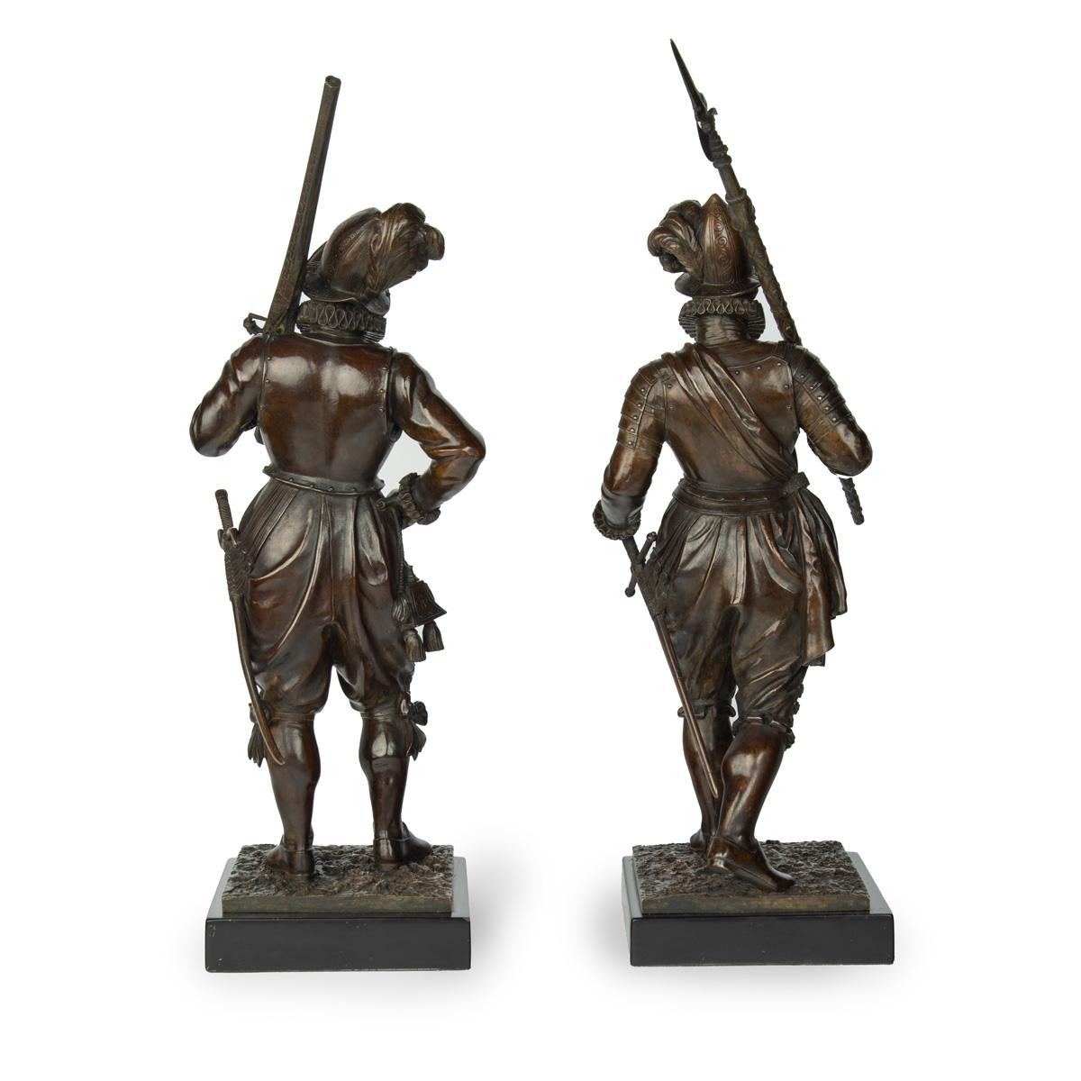 bronze standing figures of Conquistadors