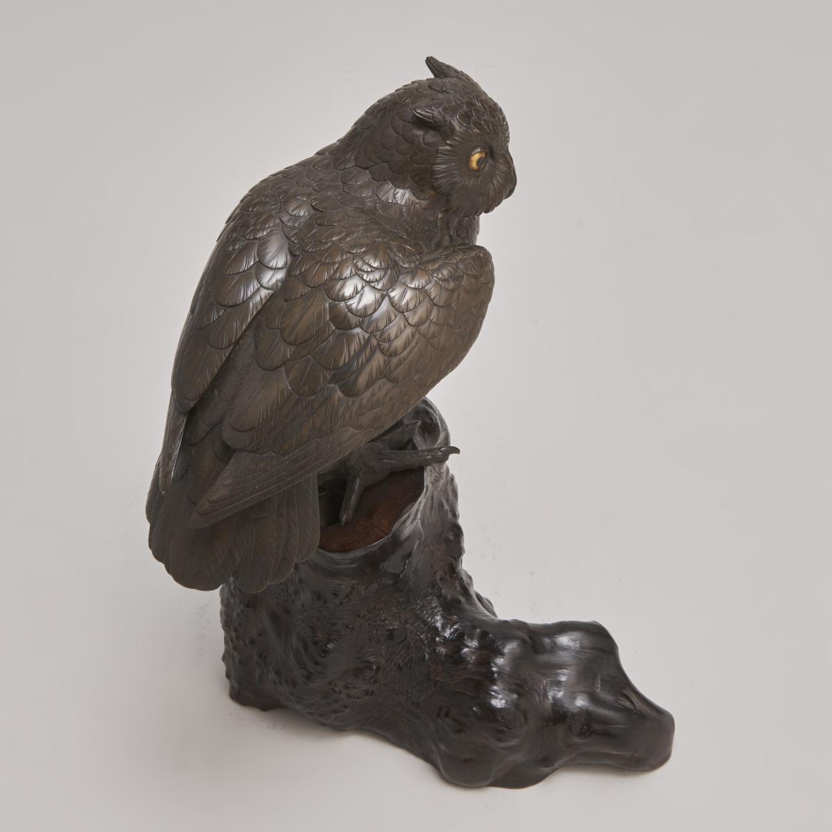 An attractive Japanese Bronze Okimono of an Owl on a gnarled wood stand (Circa 1880)