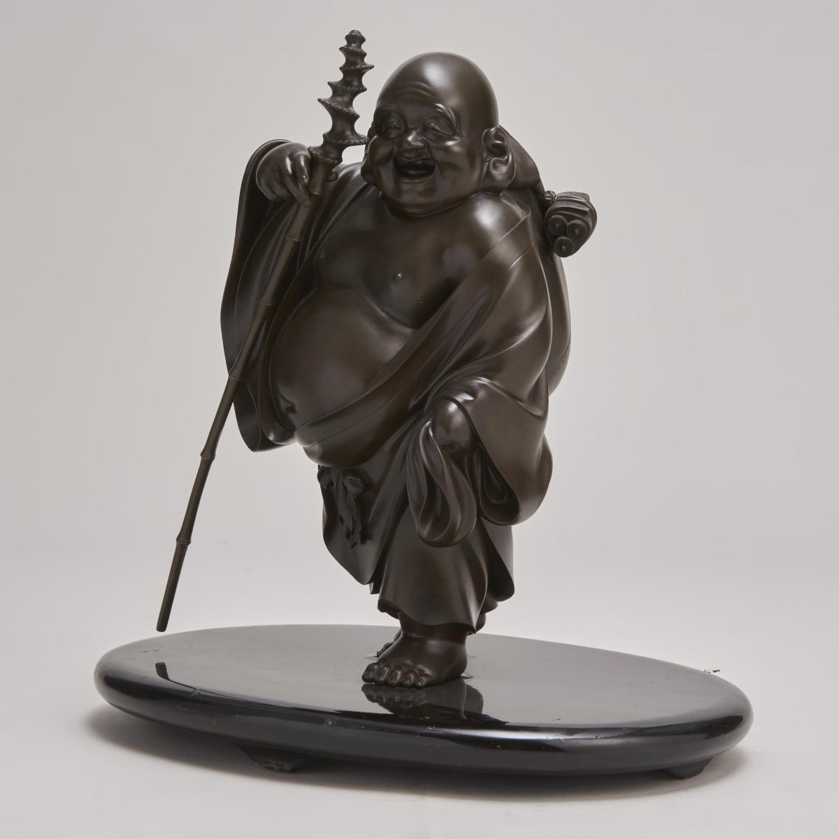 A characterful Japanese Meiji-era Bronze Okimono depicting Hotei (Circa 1900)