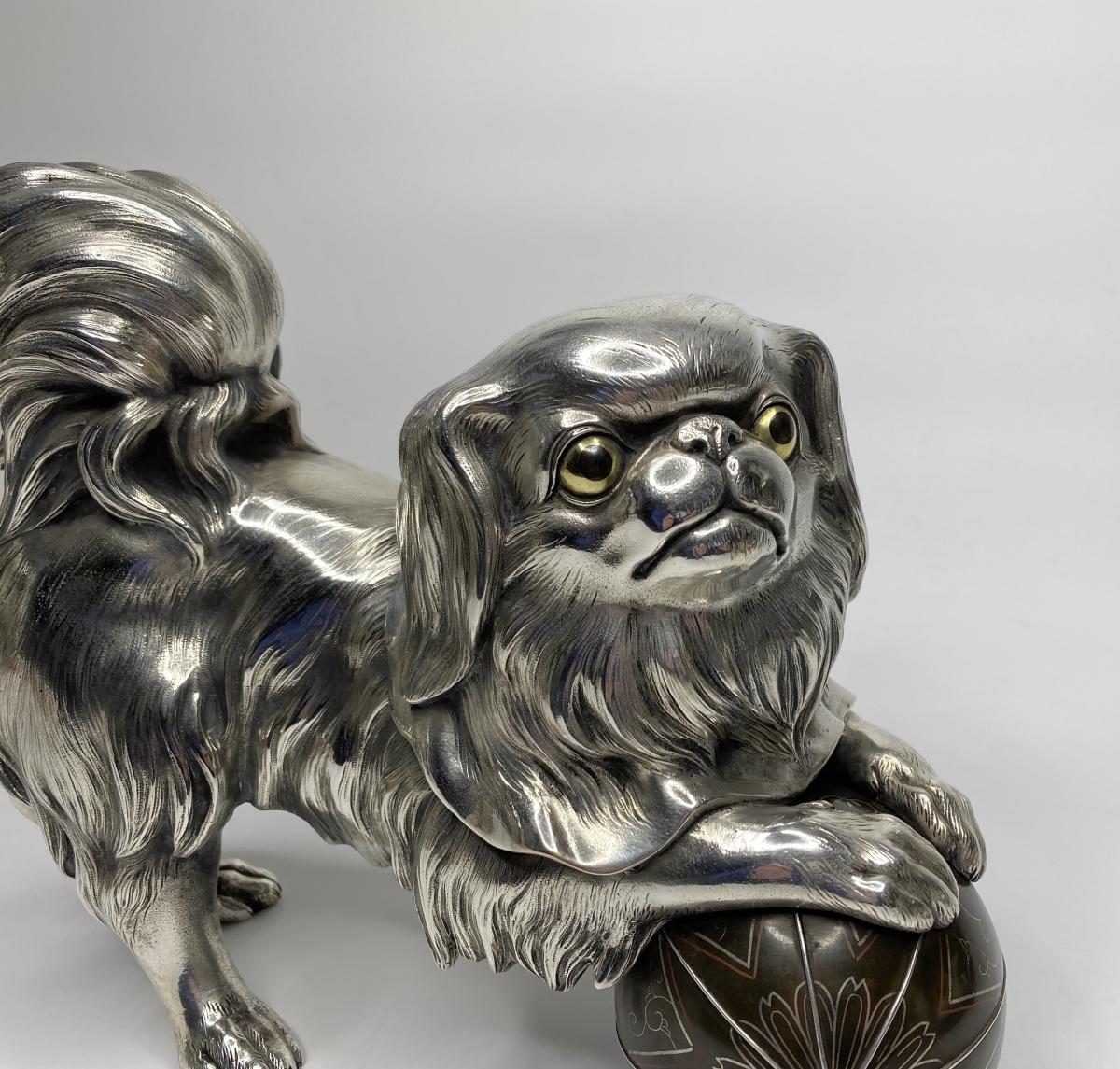 Silvered bronze okimono of a Chin puppy, Japan, Meiji Period