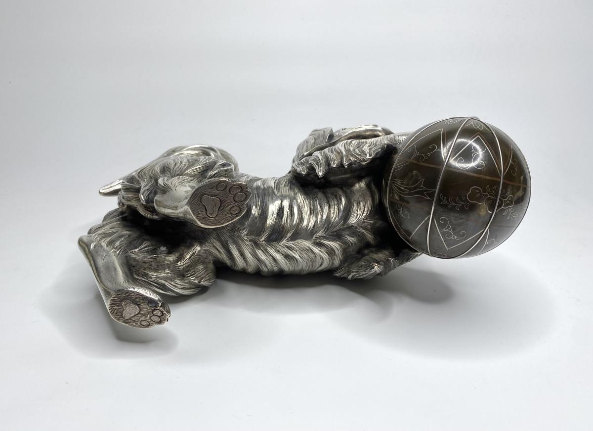 Silvered bronze okimono of a Chin puppy, Japan, Meiji Period