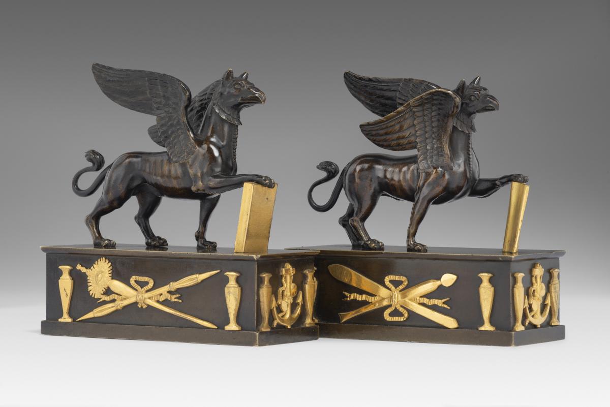 In the manner of Alexis Decaix (c. 1753-1811): A Pair of Regency Gilt-Bronze and Patinated-Bronze Griffin Paperweights