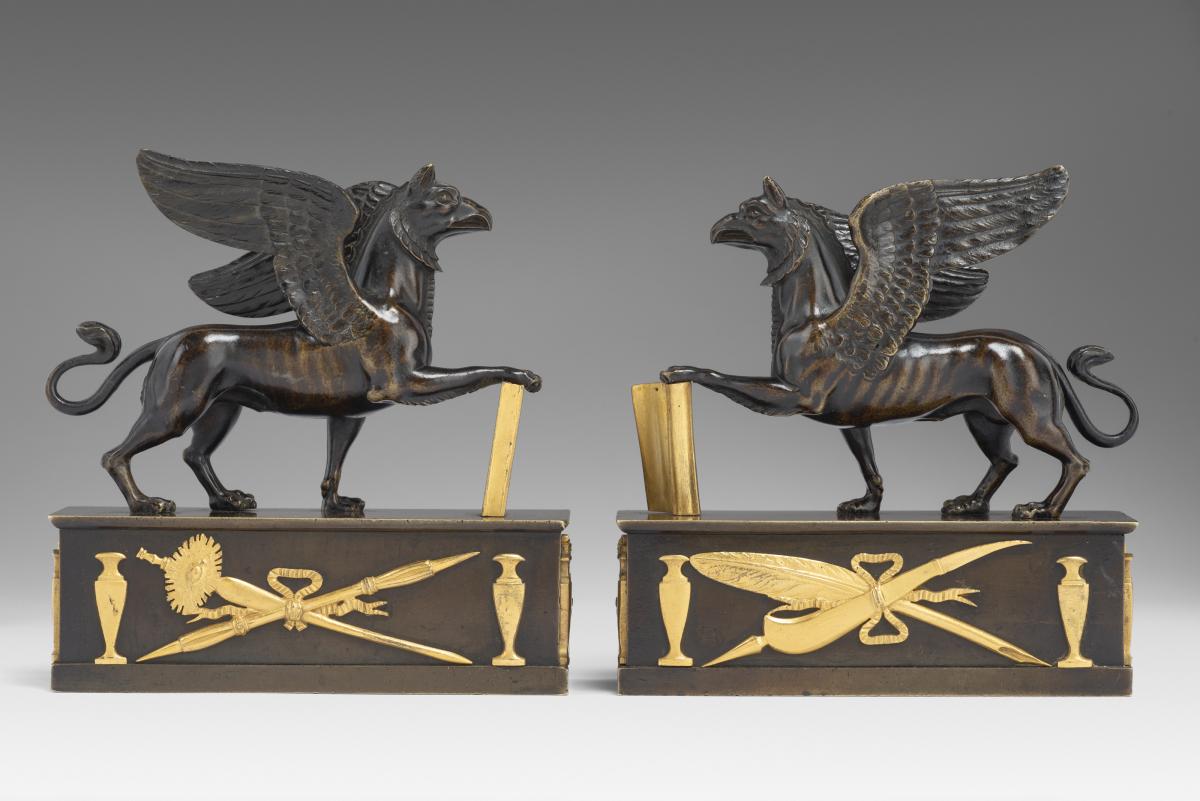 In the manner of Alexis Decaix (c. 1753-1811): A Pair of Regency Gilt-Bronze and Patinated-Bronze Griffin Paperweights