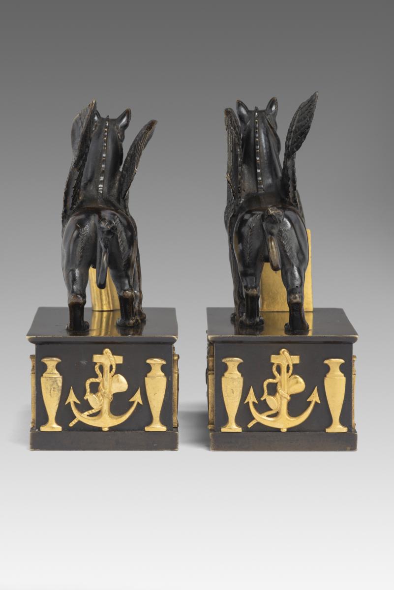 In the manner of Alexis Decaix (c. 1753-1811): A Pair of Regency Gilt-Bronze and Patinated-Bronze Griffin Paperweights