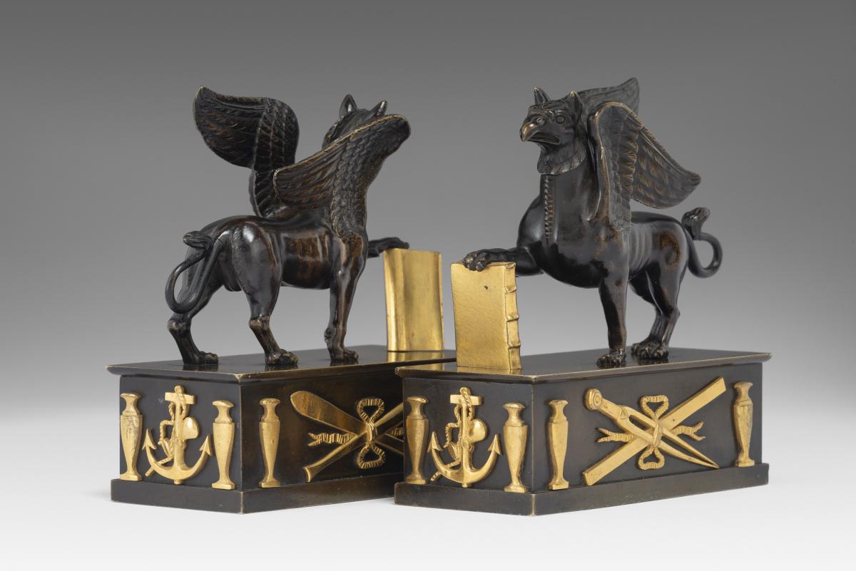 In the manner of Alexis Decaix (c. 1753-1811): A Pair of Regency Gilt-Bronze and Patinated-Bronze Griffin Paperweights