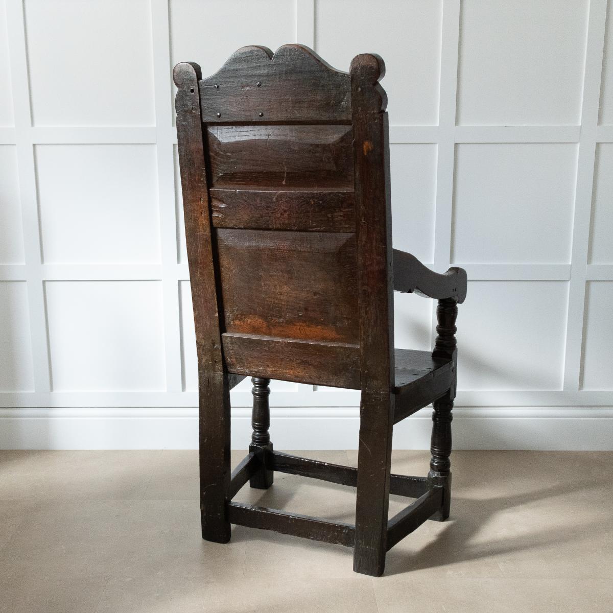 A Charles II joined oak double panel-back open armchair, Ribble Valley, Lancashire, circa 1670