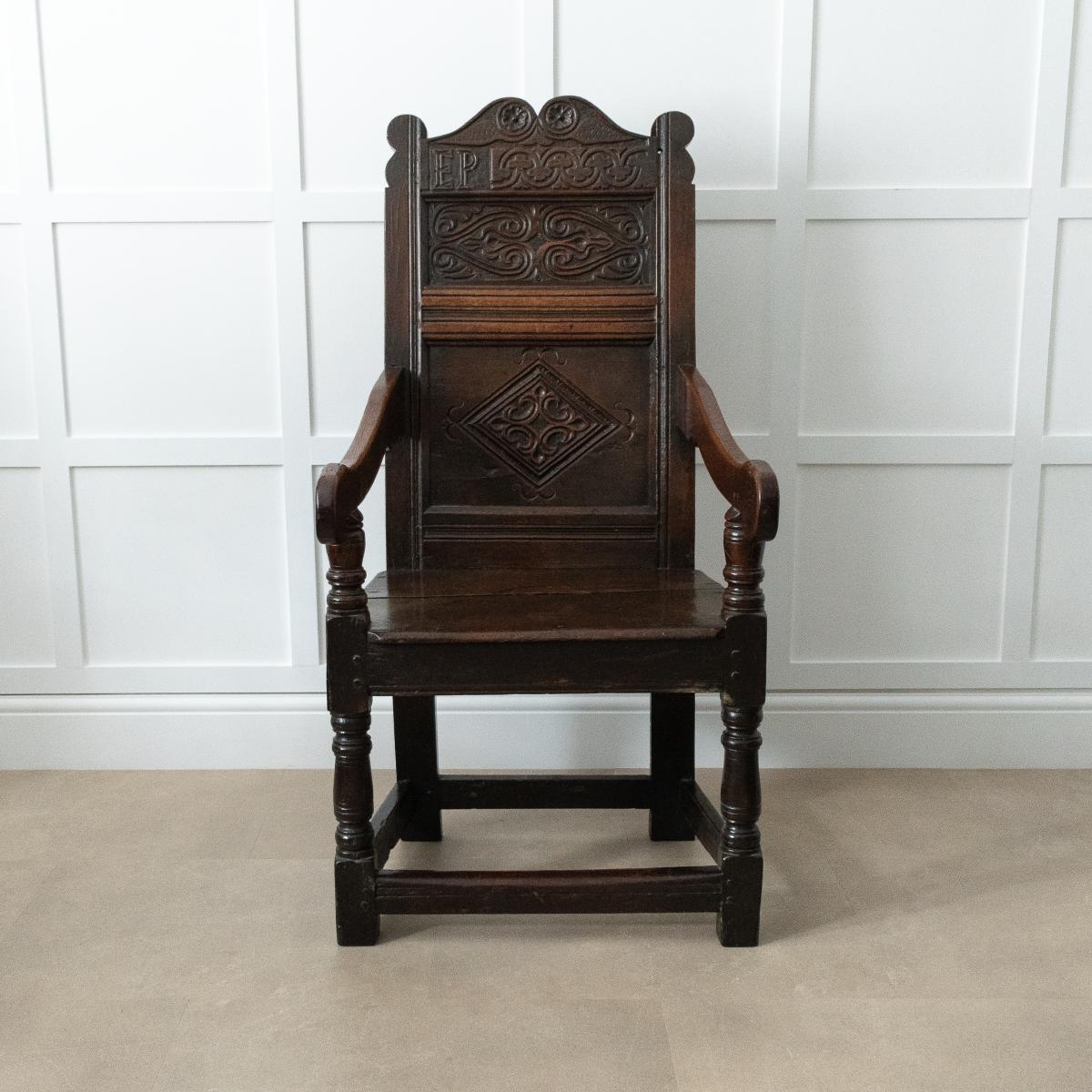 A Charles II joined oak double panel-back open armchair, Ribble Valley, Lancashire, circa 1670