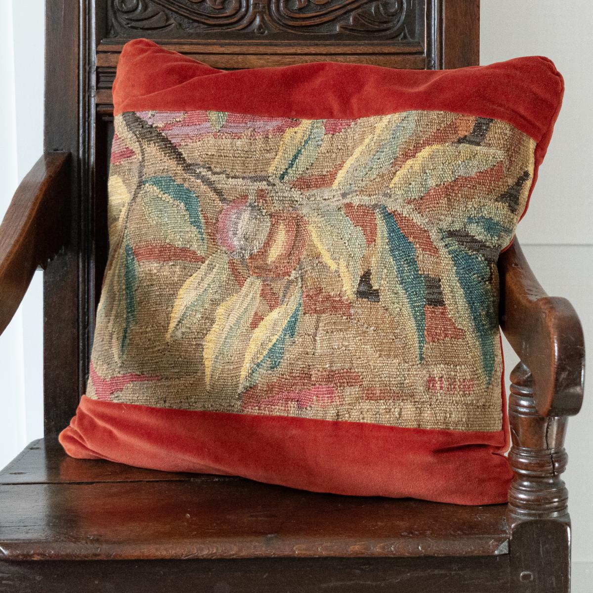 A large cushion of 17th century tapestry and velvet