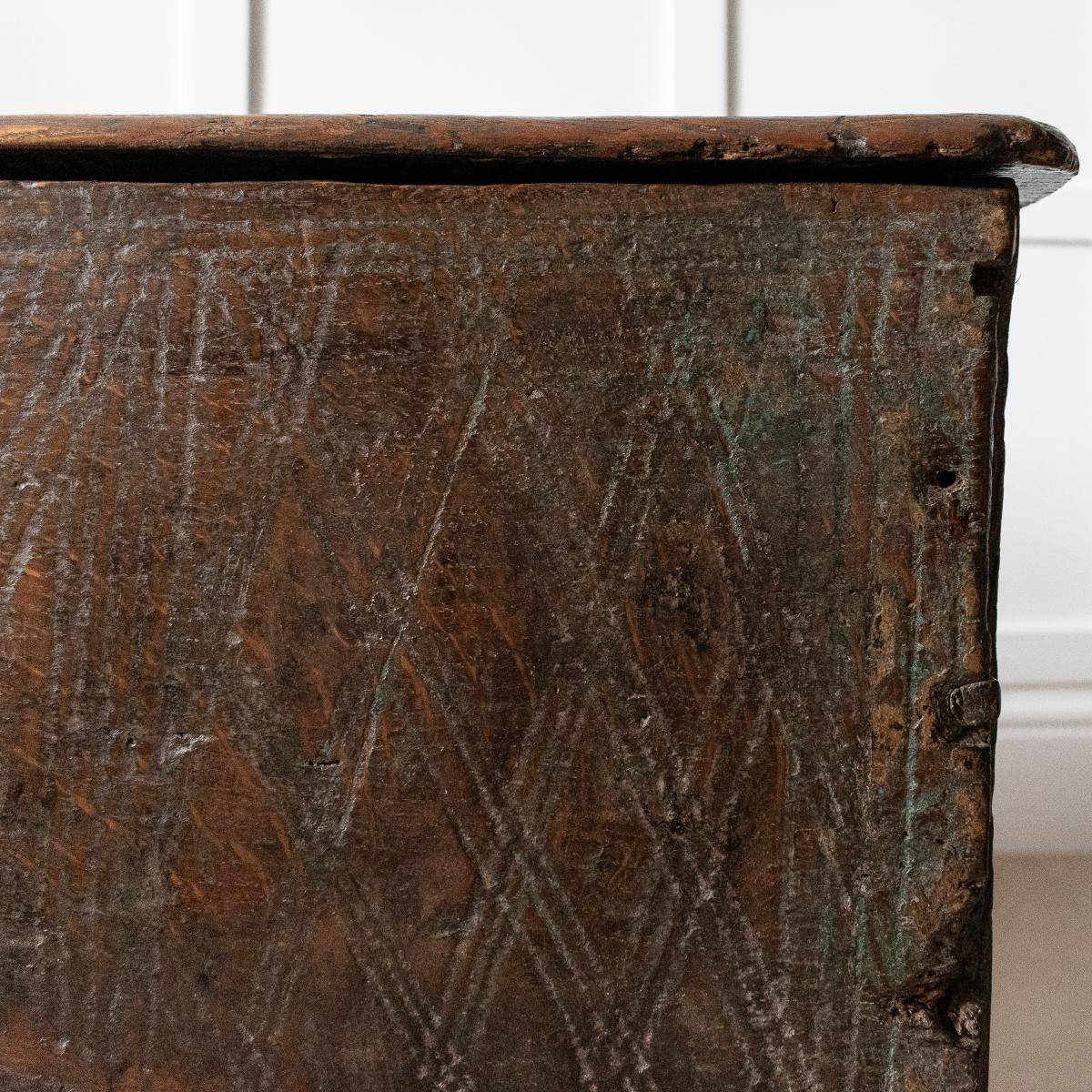 A rare Henry VIII boarded elm, oak and polychrome-decorated chest, circa 1520-30