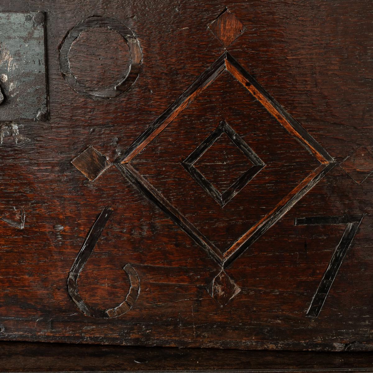 A Charles II boarded oak and inlaid box, initialled and dated 1667