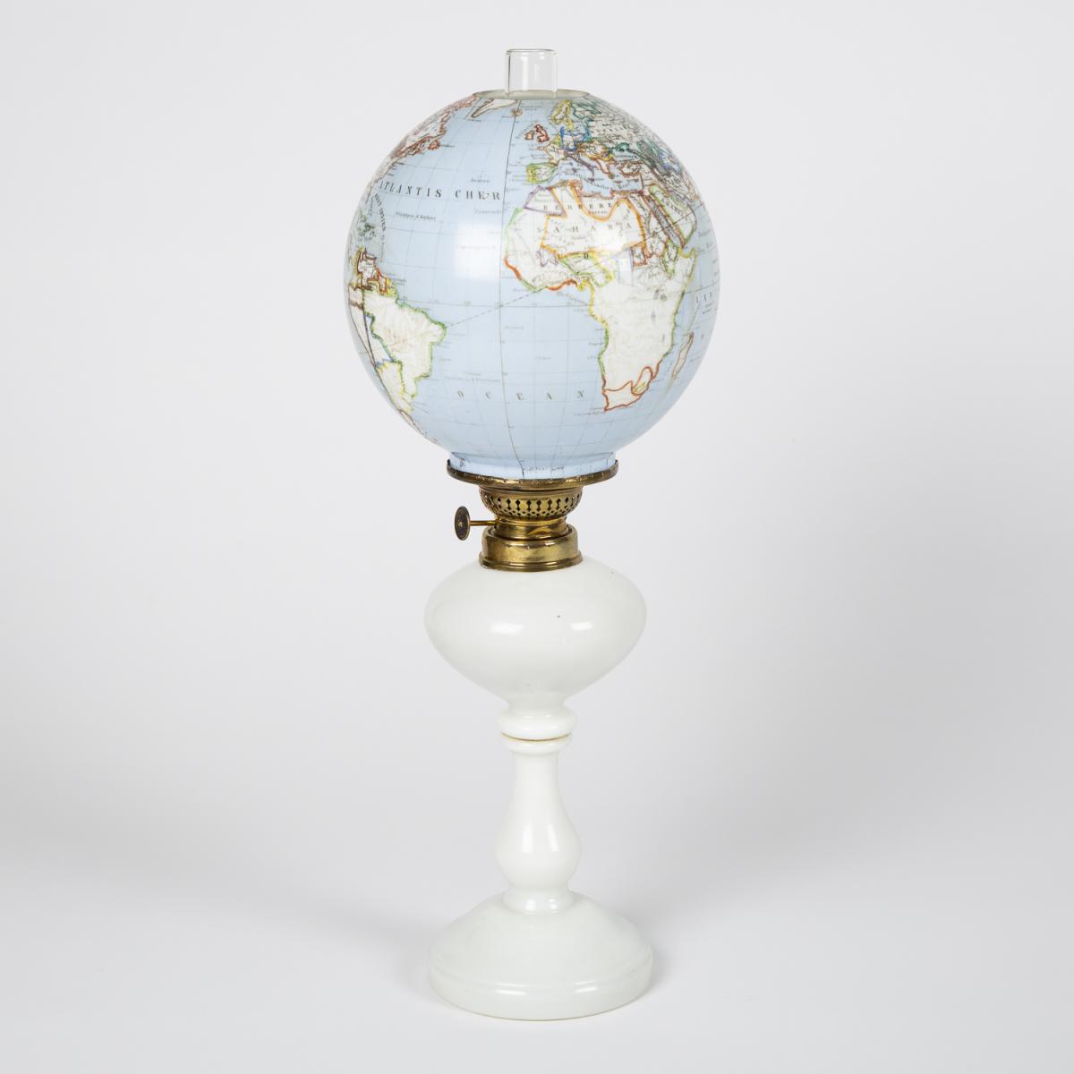 Oil lamp with an illuminating globe shade by Stelzig, Kittel & Co