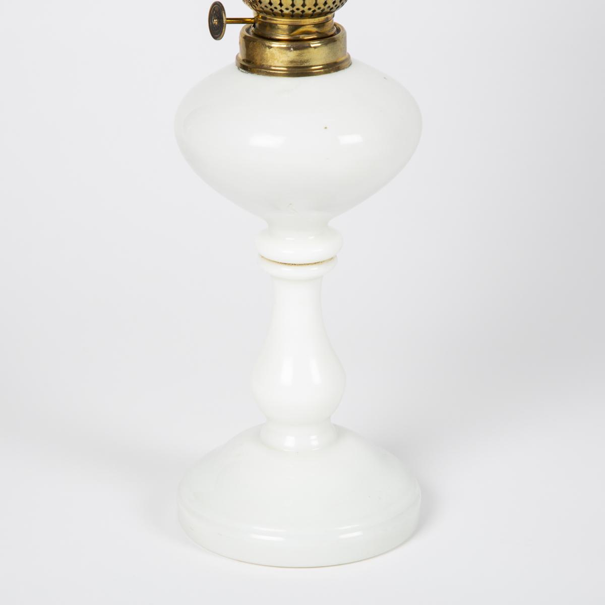 Oil lamp with an illuminating globe shade by Stelzig, Kittel & Co