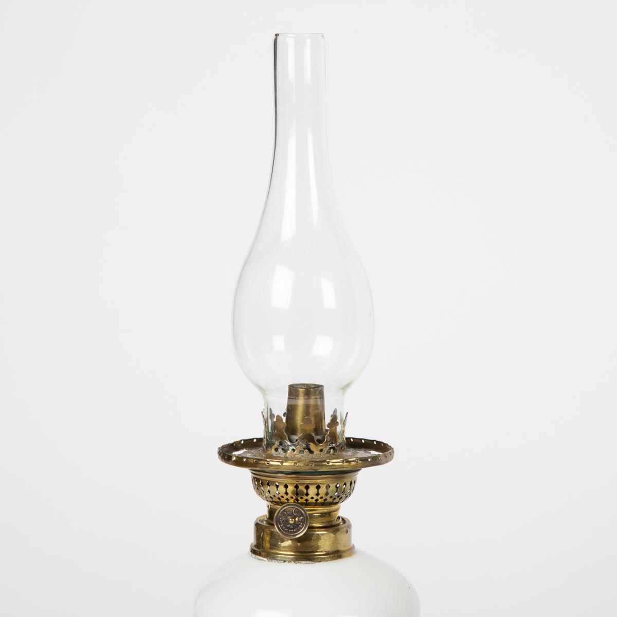 Oil lamp with an illuminating globe shade by Stelzig, Kittel & Co