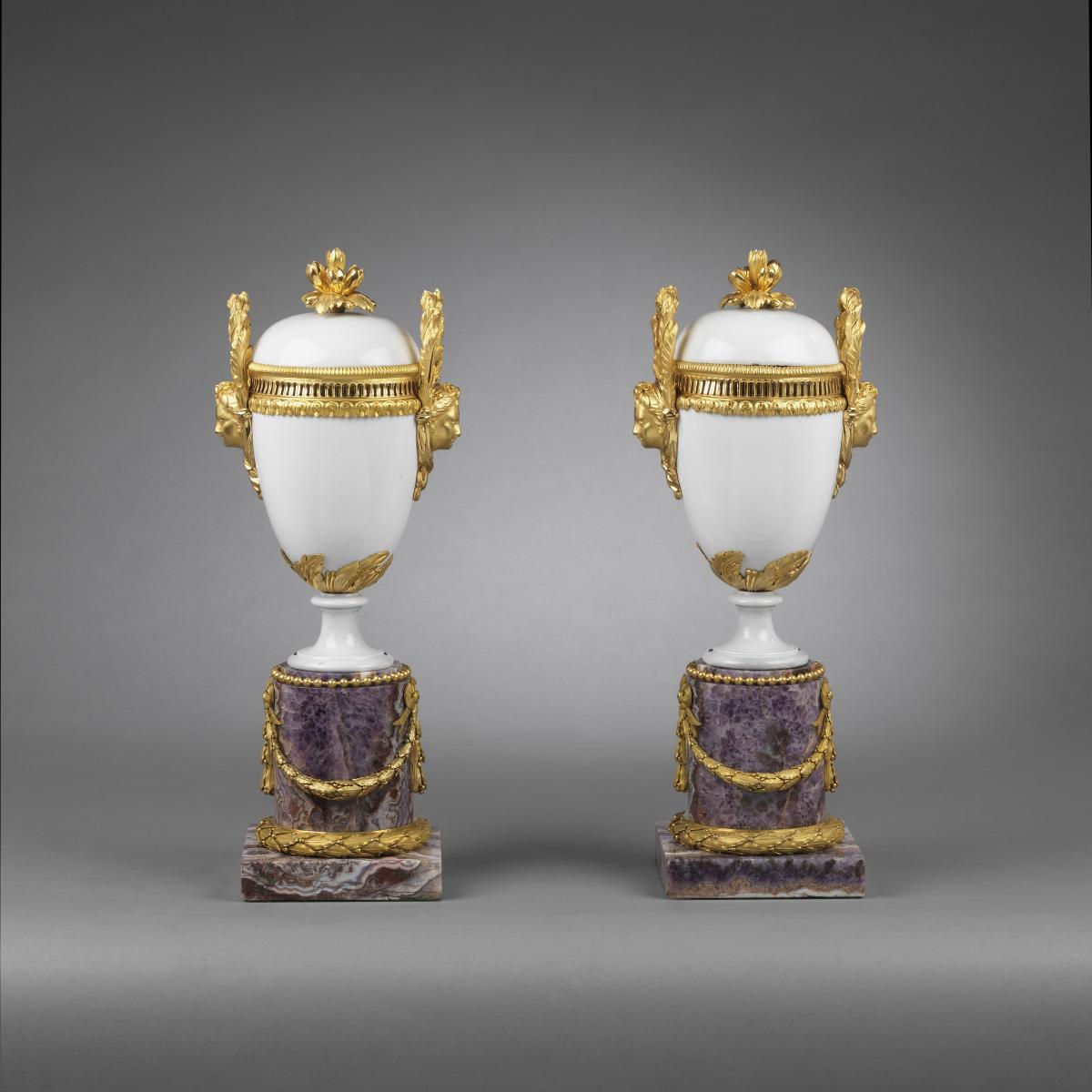 A Pair of Louis XVI Ormolu-Mounted White Locre Porcelain Vases and Covers Resting on later Amethyst Bases. Circa 1775