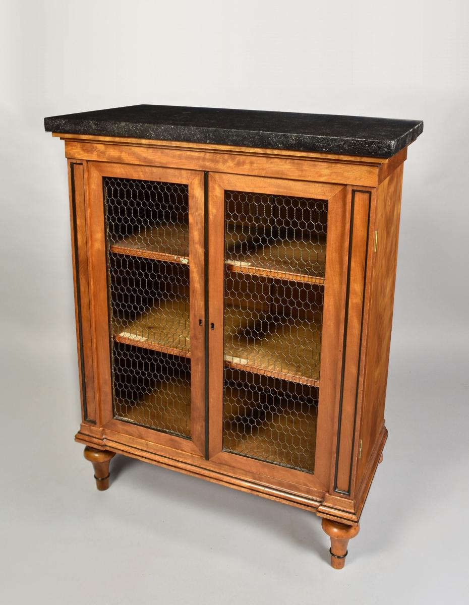 A pair of Regency satinwood cabinets with original chicken wire grills and Belgian fossil tops, c.1810