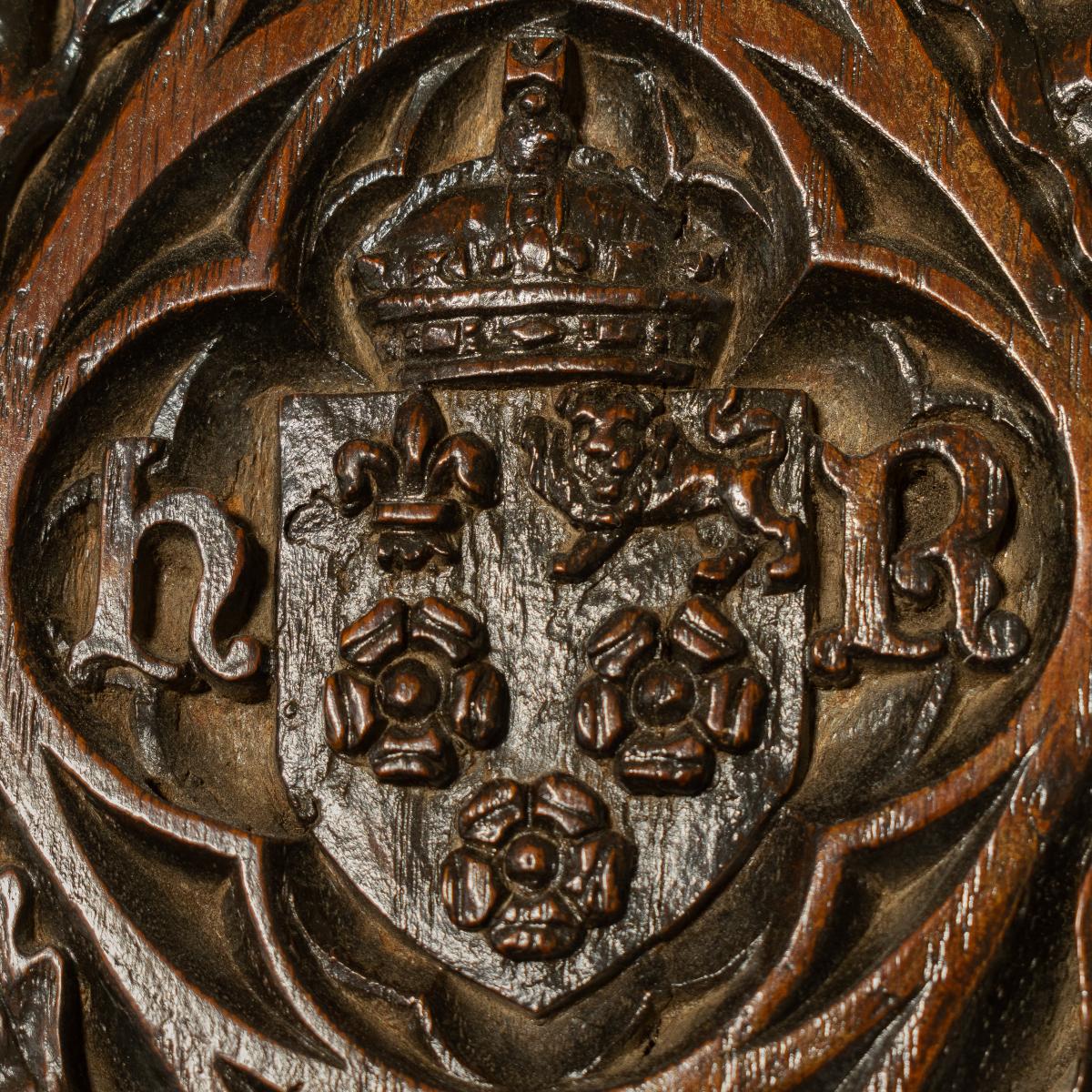 King's College Cambridge: A Henry VII/VIII oak panel, carved with the college arms and royal cypher, circa 1505-37