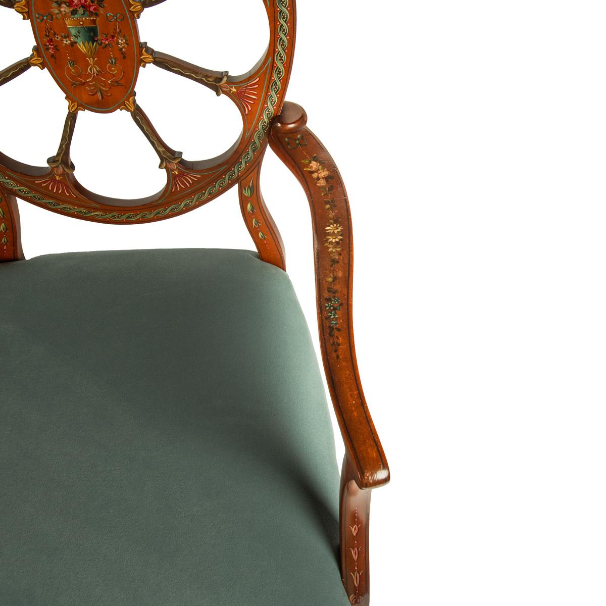 A late Victorian satinwood wheel back settee in the Chippendale style, attributed to Wright and Mansfield