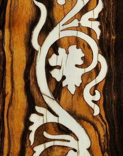 An image of wood inlaid with Ivory