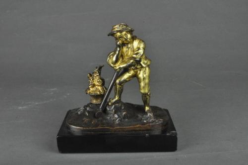 Gilt bronze figure of a farm boy