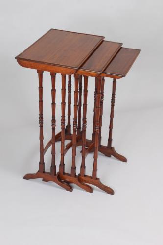 Nest of three rosewood tables