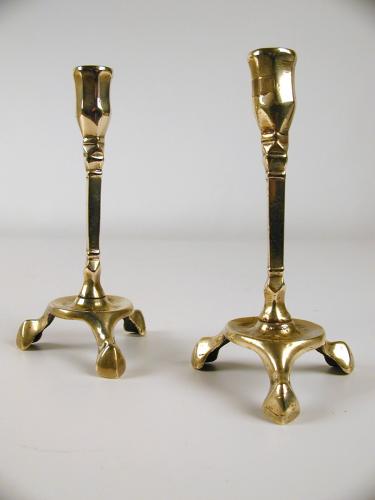 A rare pair of brass candlesticks