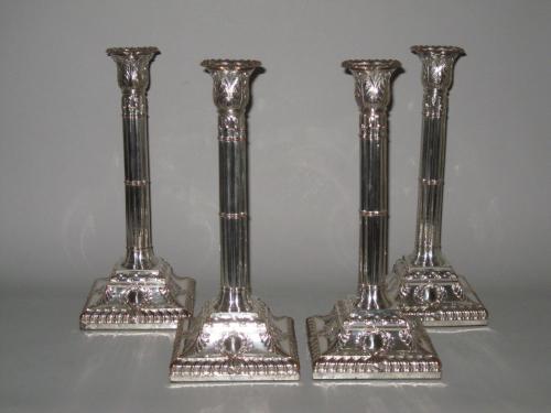 SET OF FOUR OLD SHEFFIELD PLATE SILVER CANDLESTICKS. GEORGE III, CIRCA 1765-1770